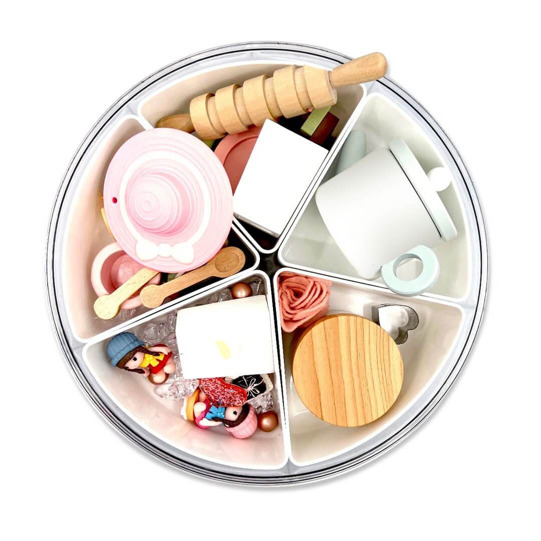 Tea-party pieces and playdough jar in divided storage; pink tea-party hat not included