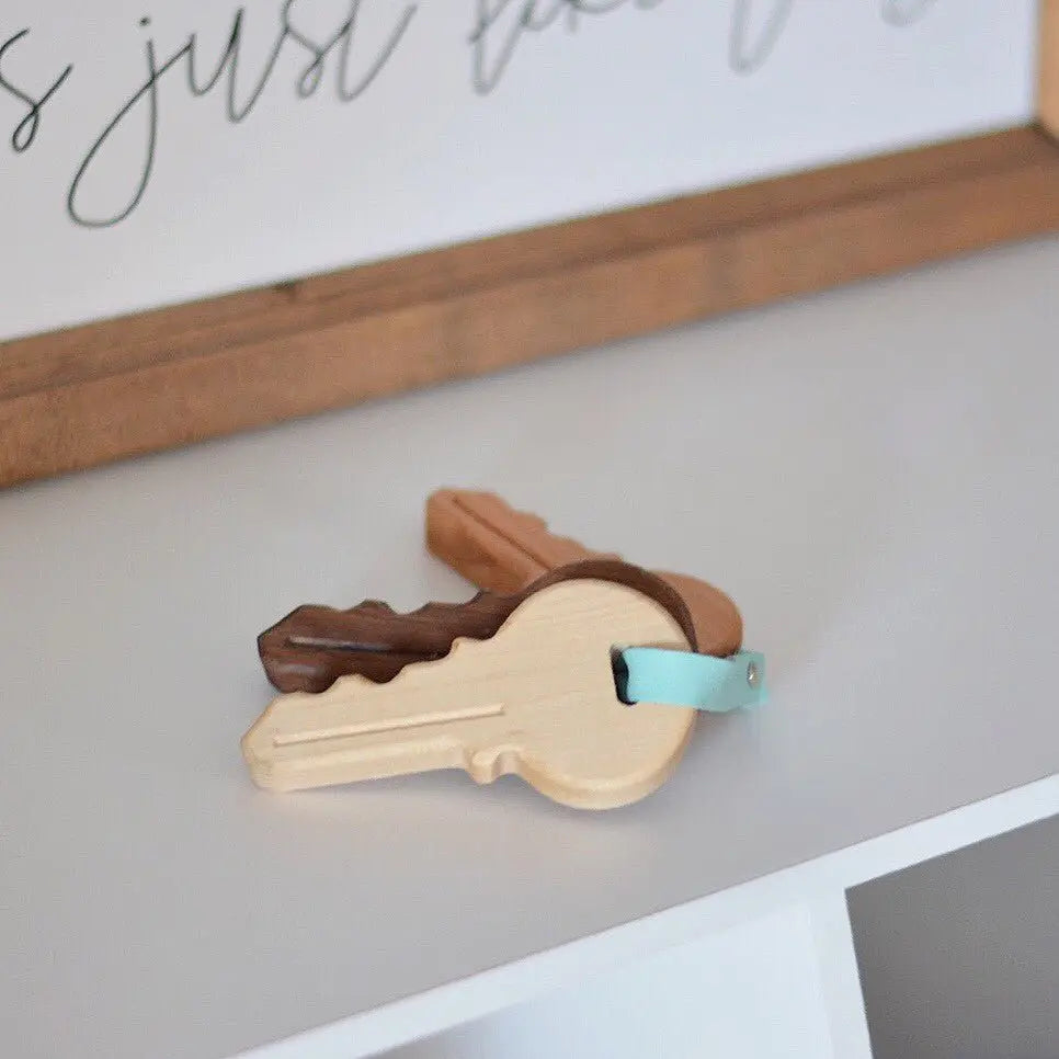 Wooden toy keys displayed on a shelf