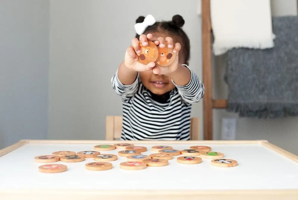 Lifestyle photo showing woodland animal matching tiles with a child