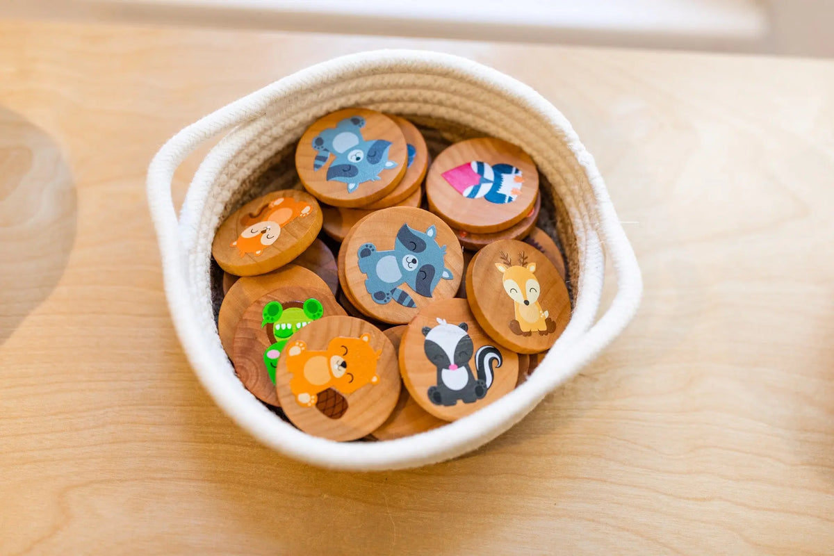 Woodland animal matching tiles collected in a small basket