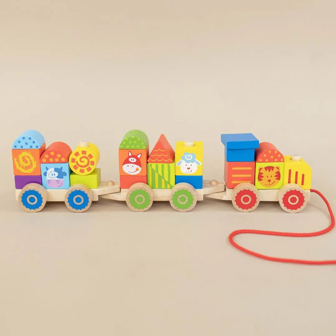 SpiritnSprout: Three connected farm-themed wooden train cars with stacking blocks and pull string
