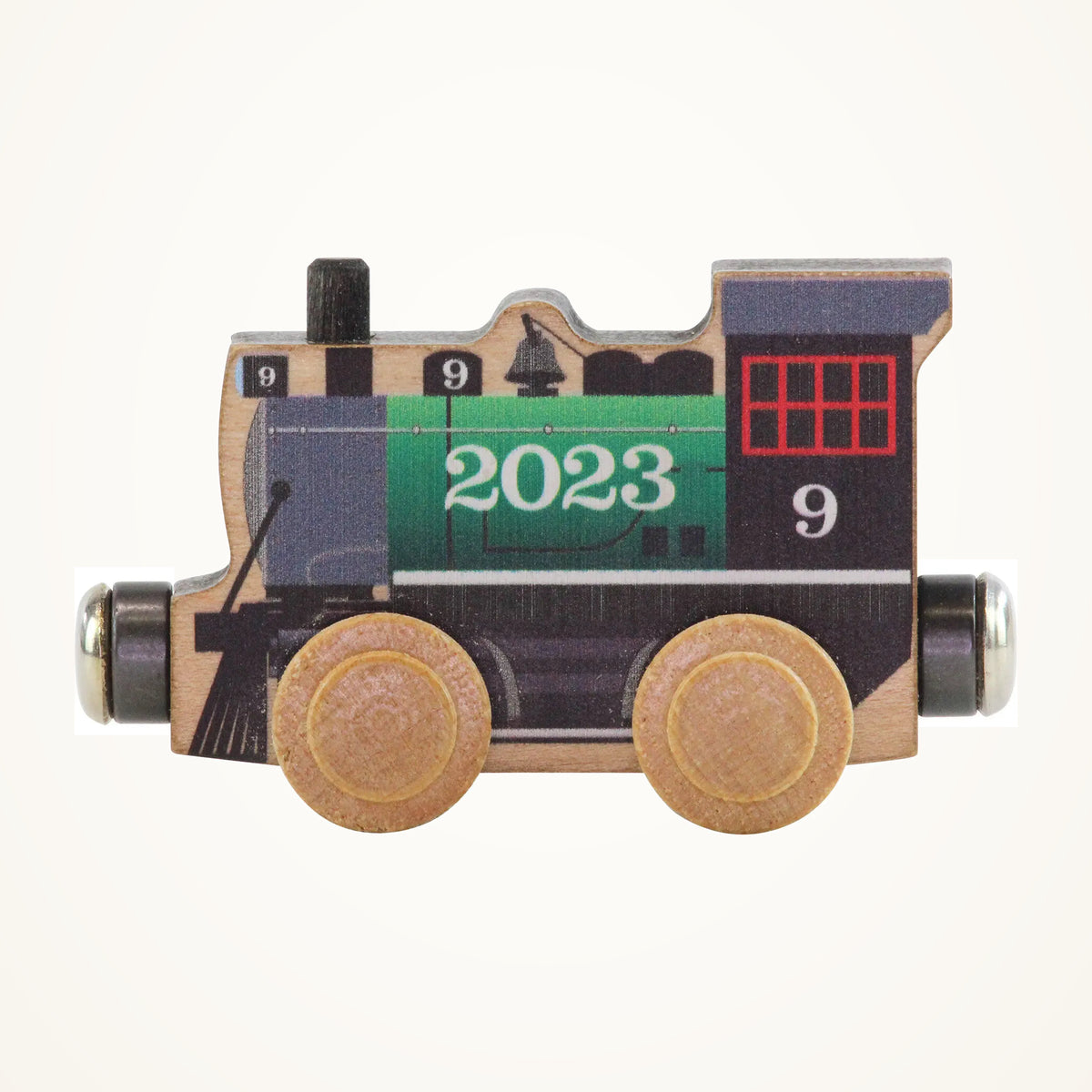Maple Landmark NameTrains 2023 Wooden Train Engine photographed on a warm ivory background.