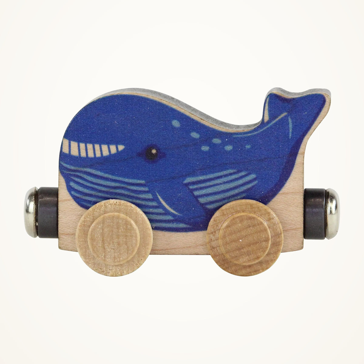 Maple Landmark NameTrains Wally Whale Wooden Train Car photographed on a warm ivory background.