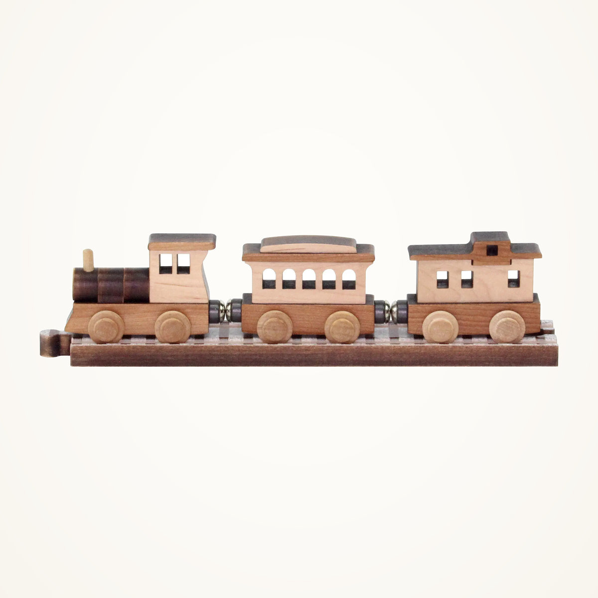 Maple Landmark NameTrains Old West Wooden Train Set, 3 Cars photographed on a warm ivory background.