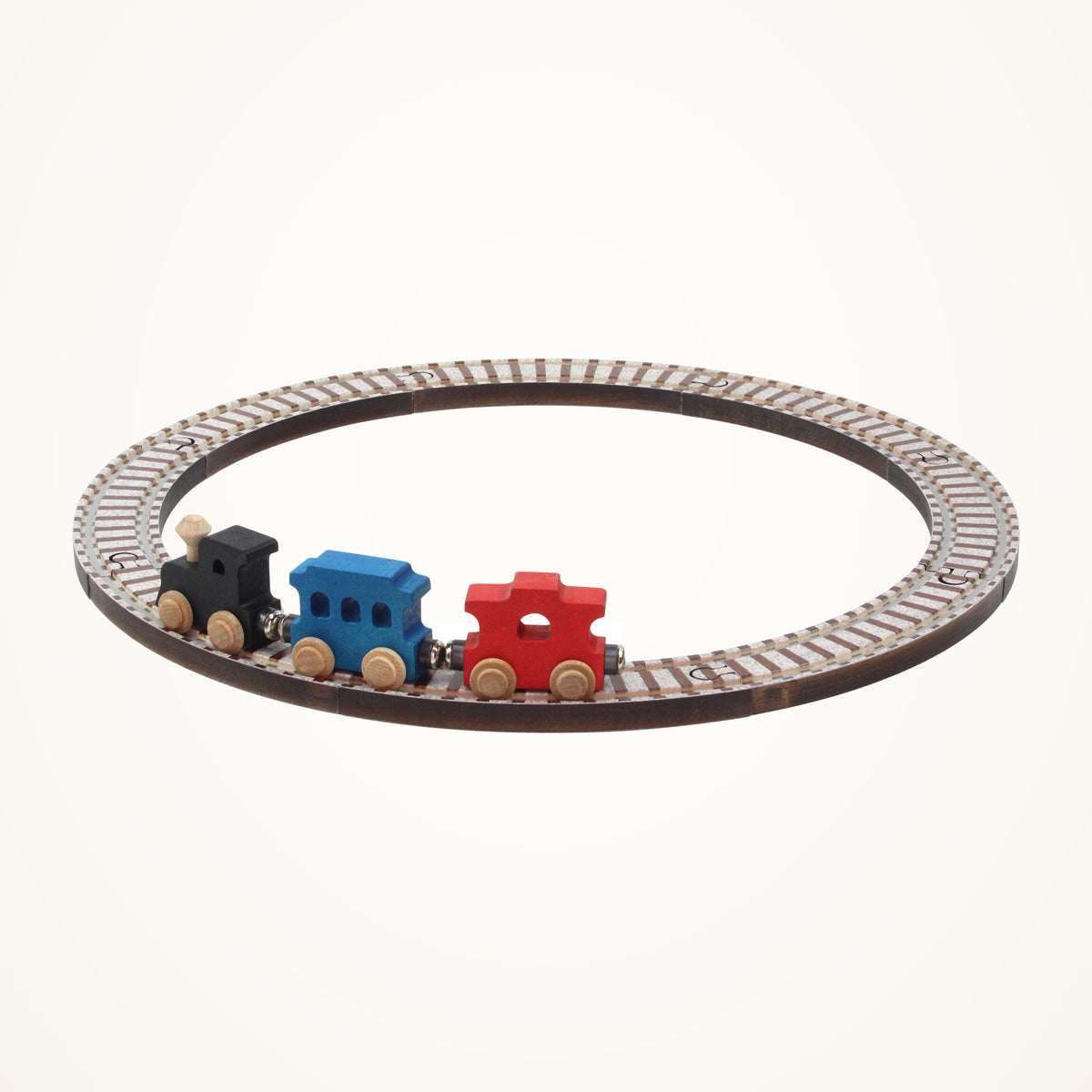 Maple Landmark NameTrains Starter Wooden Train Set, 11 Pieces photographed on a warm ivory background.