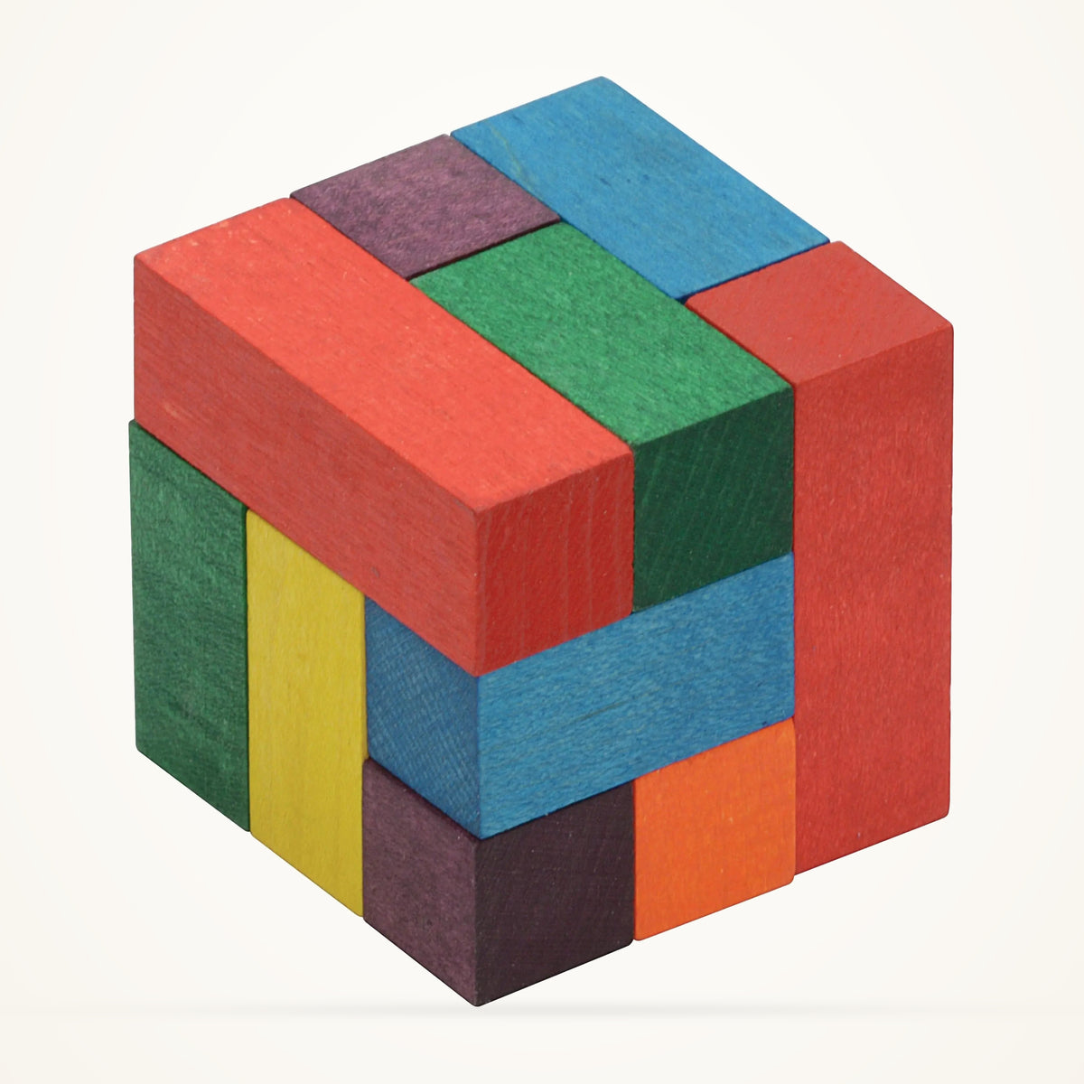Maple Landmark Color Soma Cube photographed on a warm ivory background.