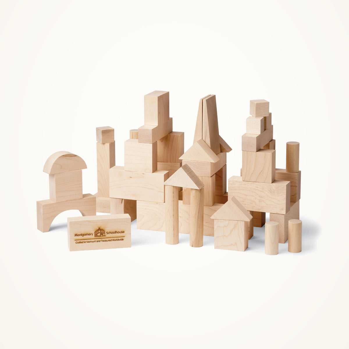 Maple Landmark Junior Builder Wooden Blocks Set - 41 Pieces photographed on a warm ivory background.