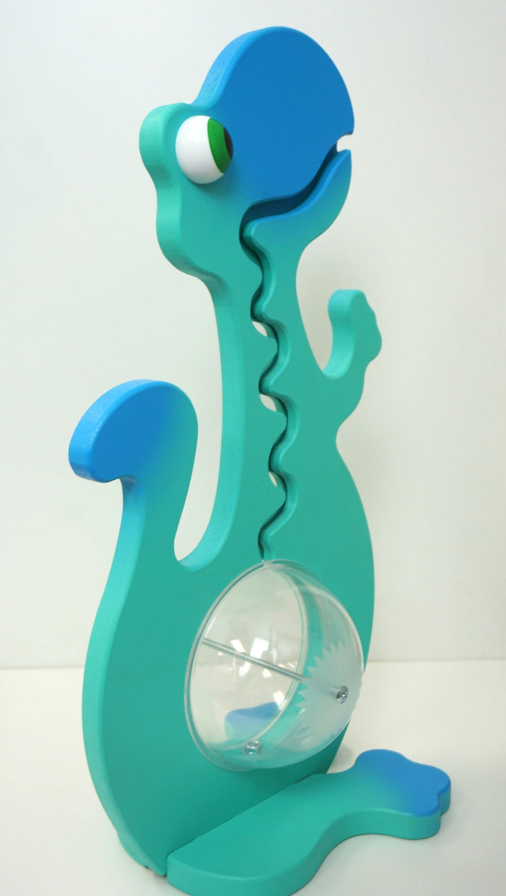 Angled view of the aqua and blue dinosaur coin bank