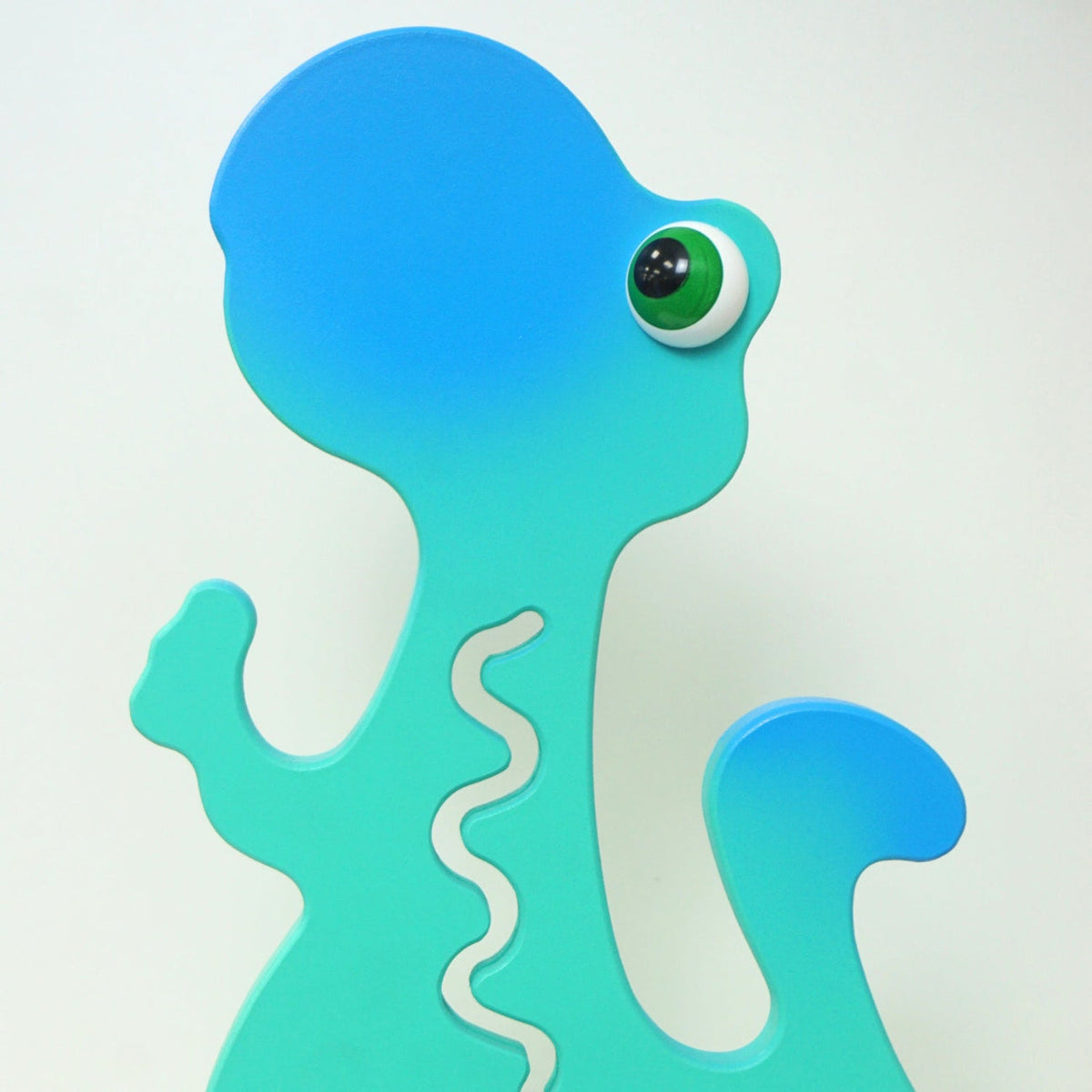 Reverse-side close-up of the aqua dinosaur head and upper body