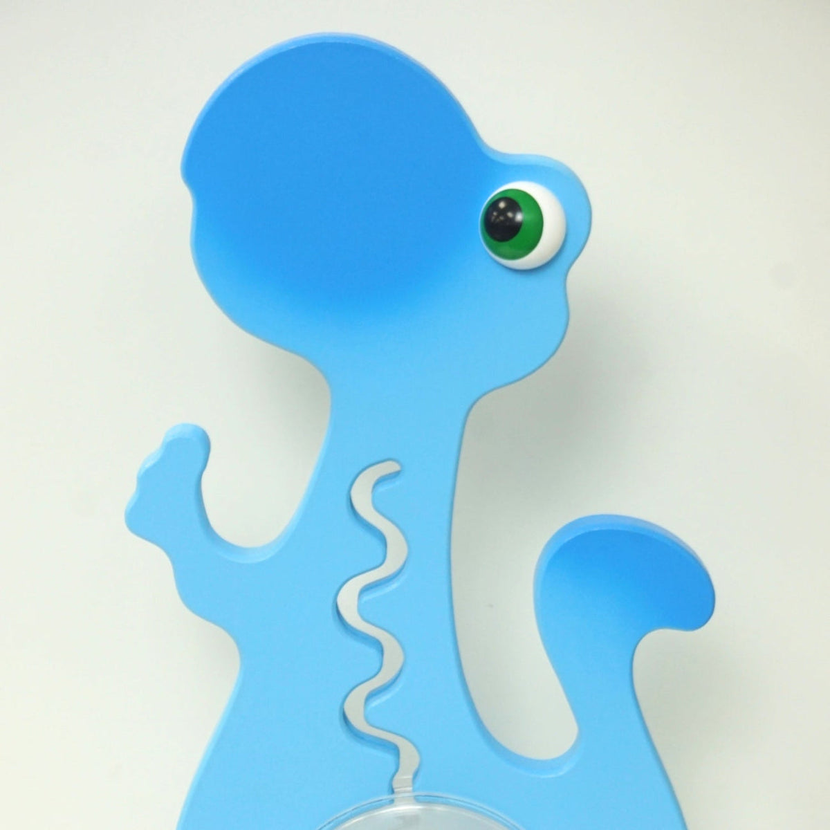 Reverse-side close-up of the blue dinosaur head and upper body