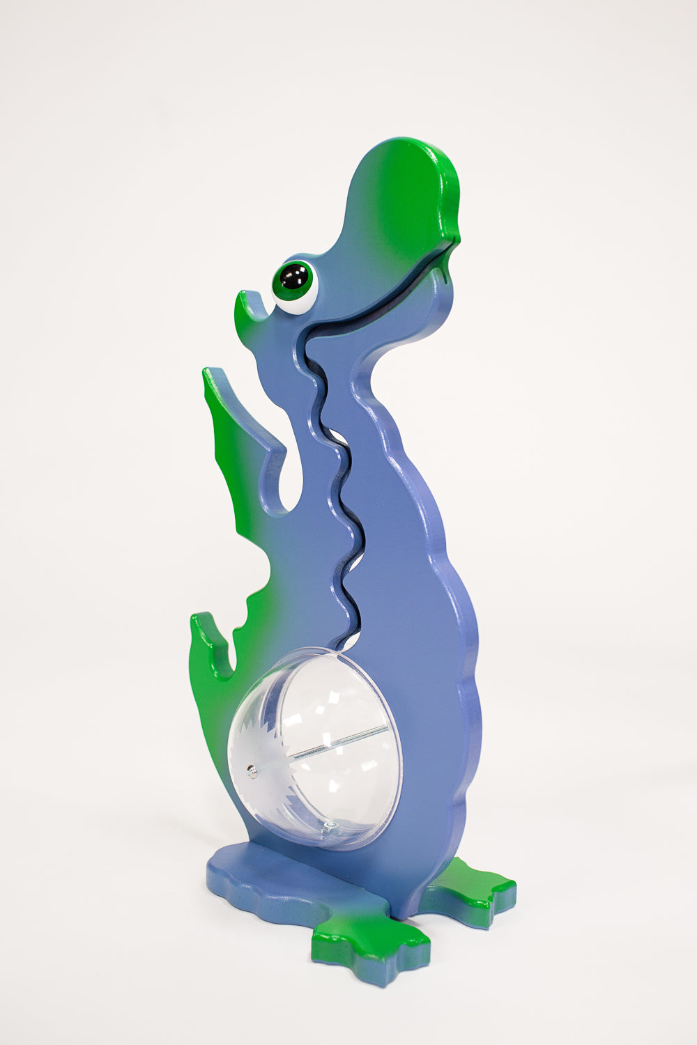 Angled view of the green and purple dragon coin bank