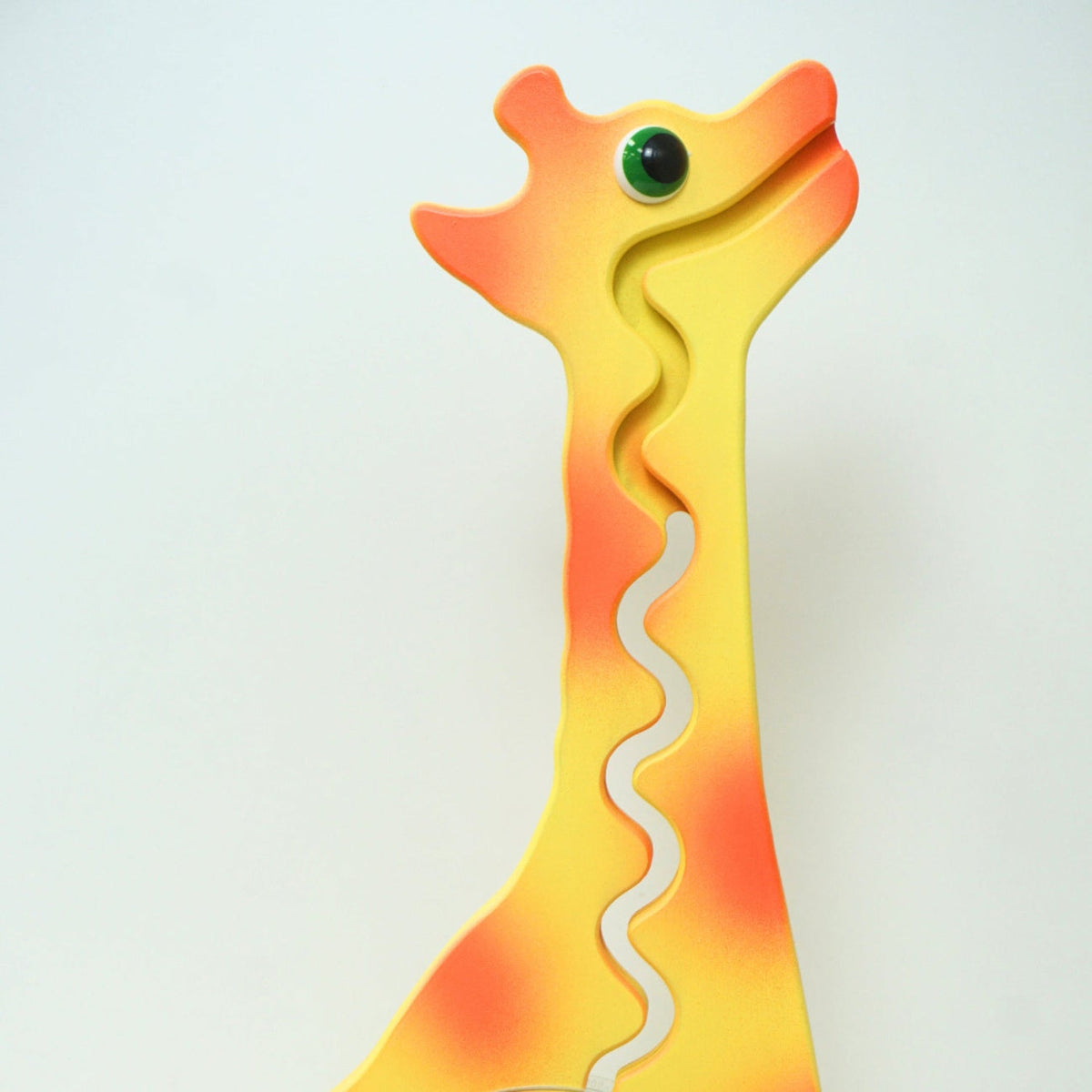 Close-up of the giraffe head and front coin track