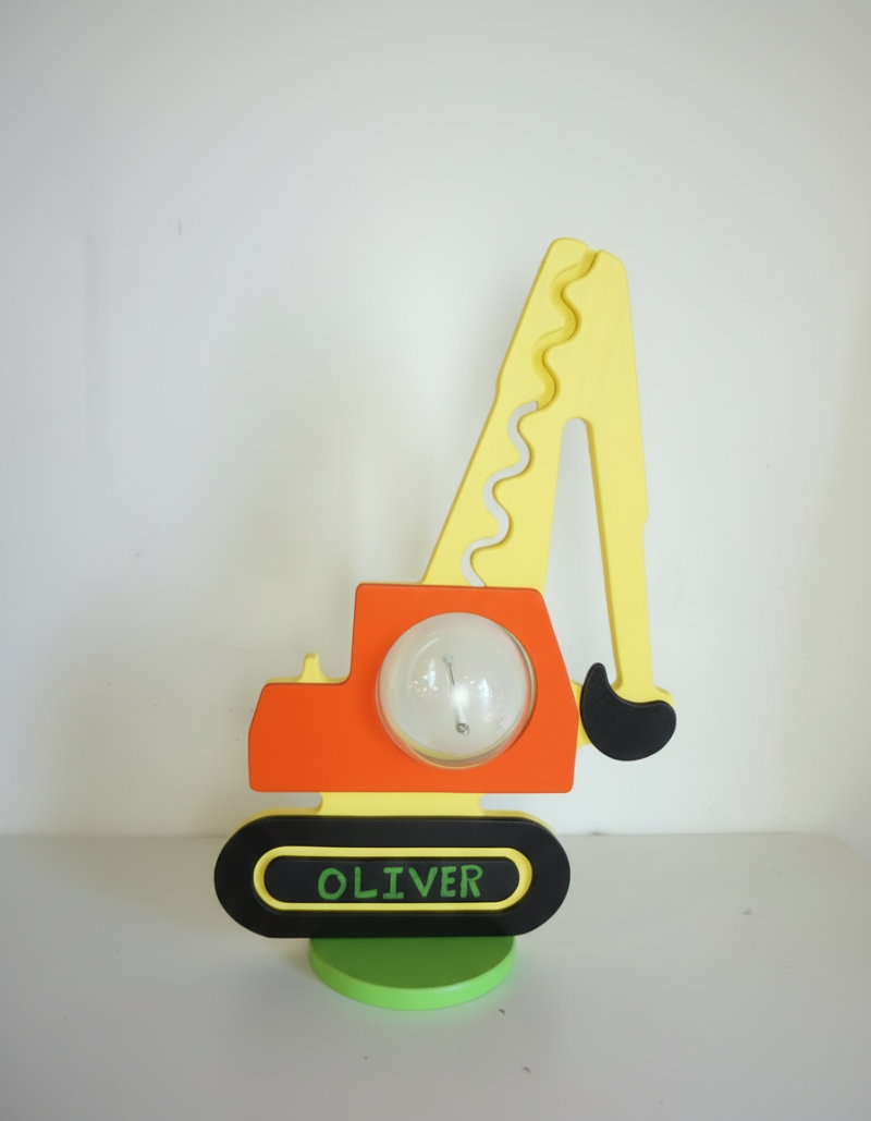 Excavator bank showing an example of personalized name lettering on the tracks
