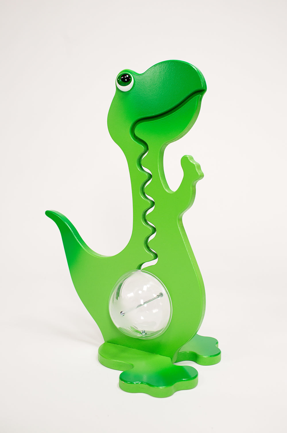Green dinosaur coin bank with zigzag coin track, clear belly and matching base