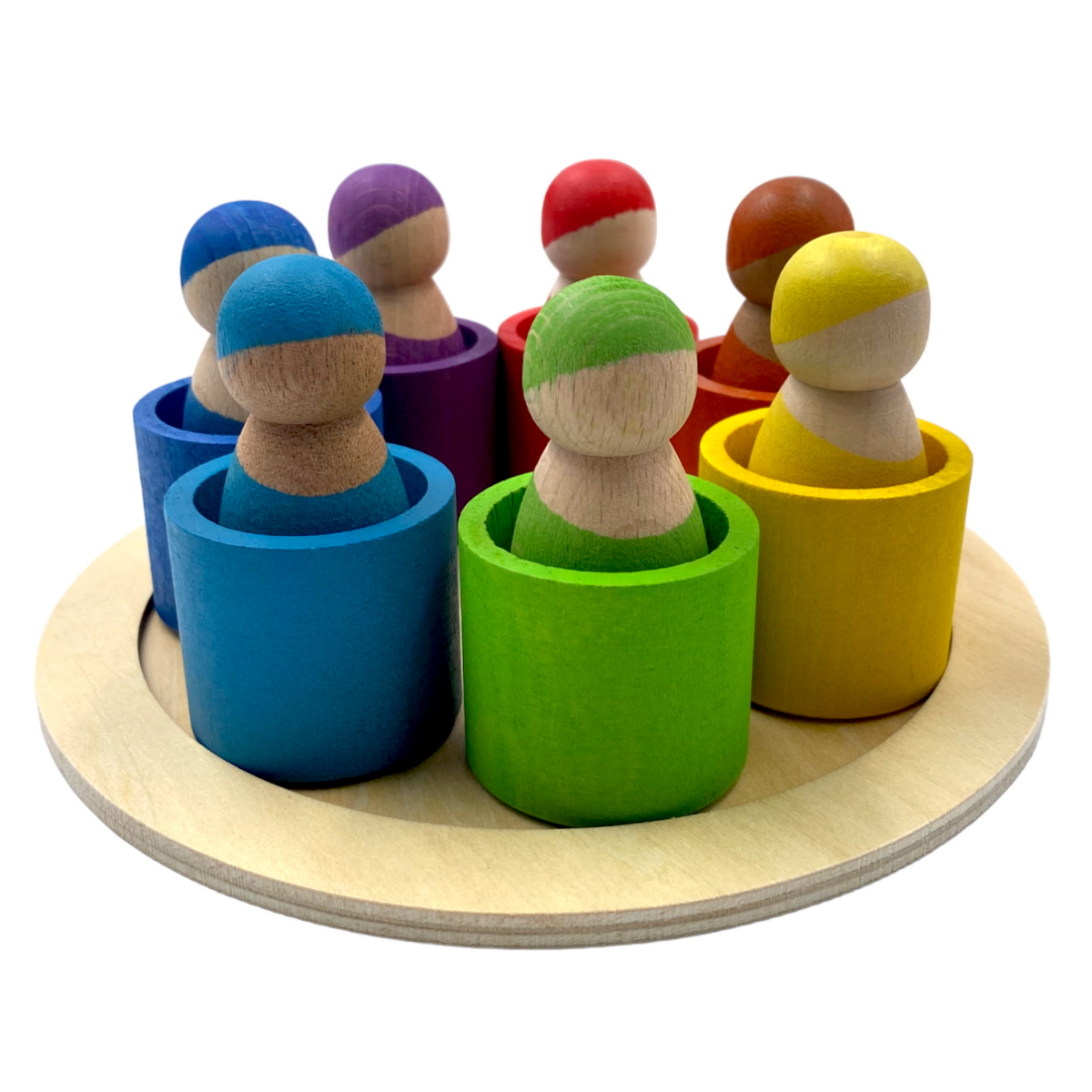 Angled view of peg dolls in blue, green, yellow, and other rainbow bowls