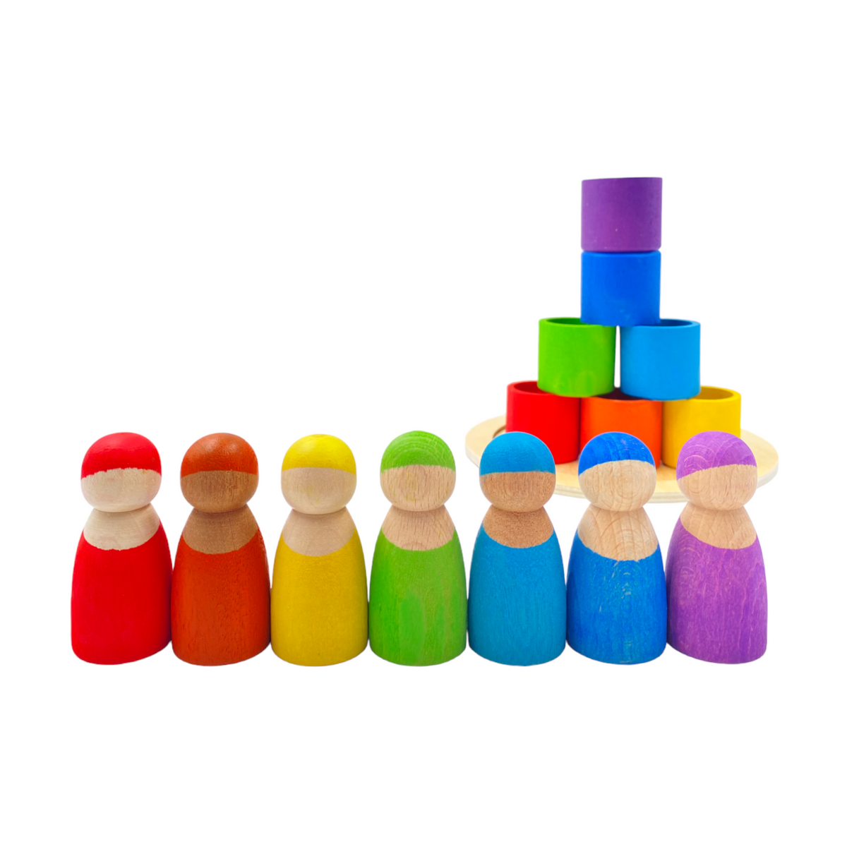 Seven rainbow peg dolls in front of a pyramid made from their matching bowls