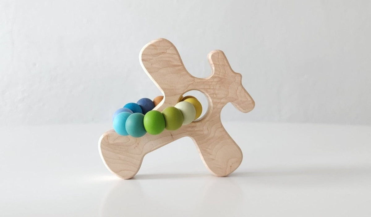 Bannor Toys Airplane Wooden Grasping Toy with Teething Beads, showing wooden outline and attached silicone beads