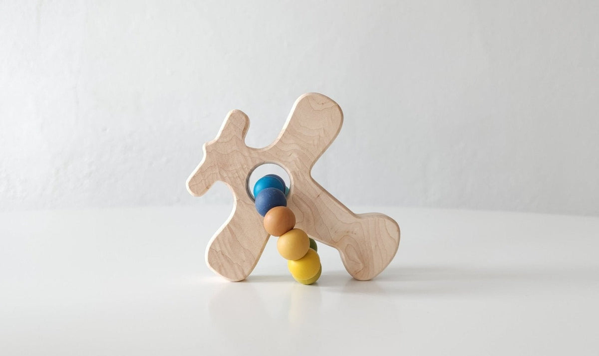 Bannor Toys Airplane Wooden Grasping Toy with Teething Beads, showing wooden outline and attached silicone beads
