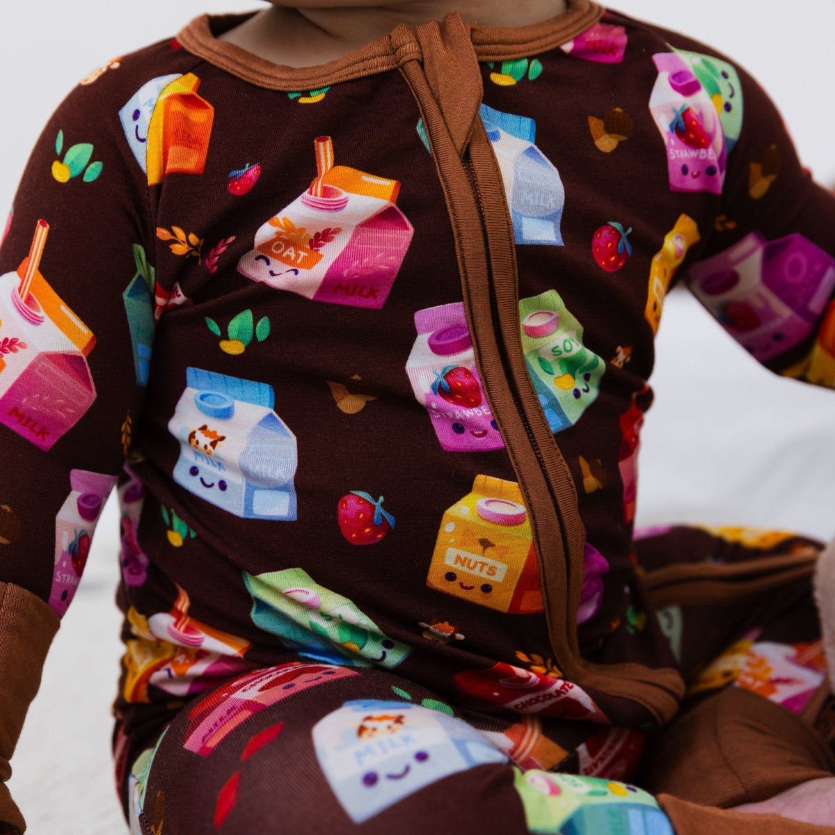 Close-up of the front zipper and fabric on Bam & Stitch All the Milks! Convertible Romper.