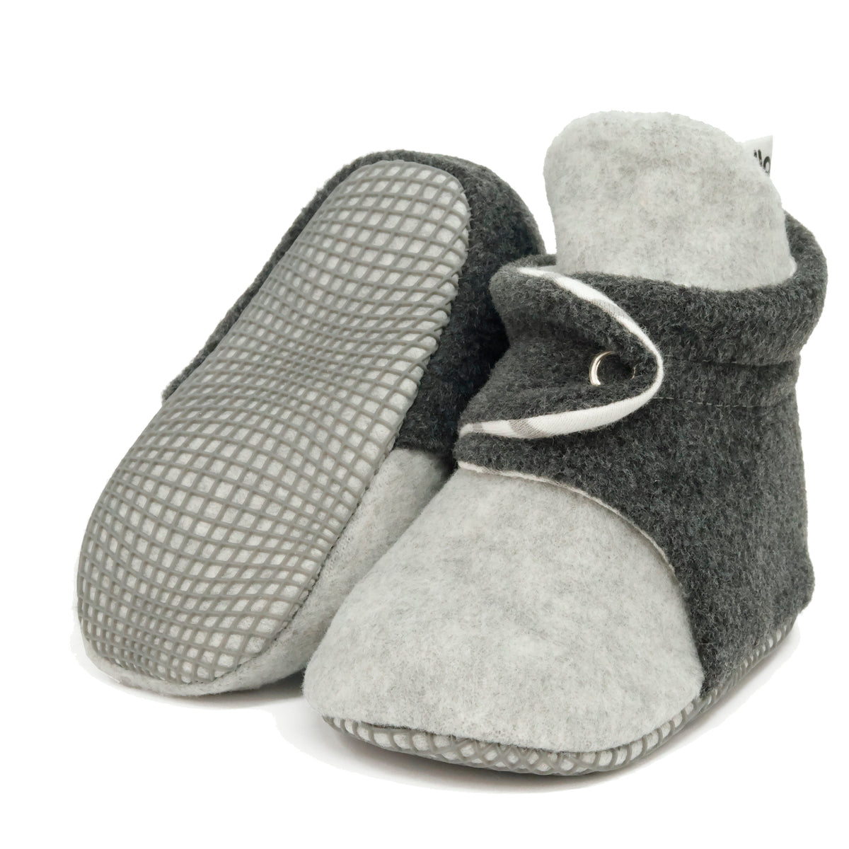 Gray-and-charcoal fleece baby booties with striped lining and snap straps, with one sole facing the camera on a white background.