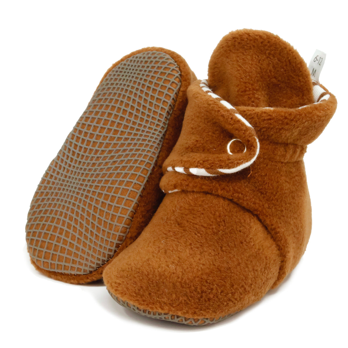 Warm brown fleece baby booties with striped lining and snap straps, with one sole facing the camera on a white background.