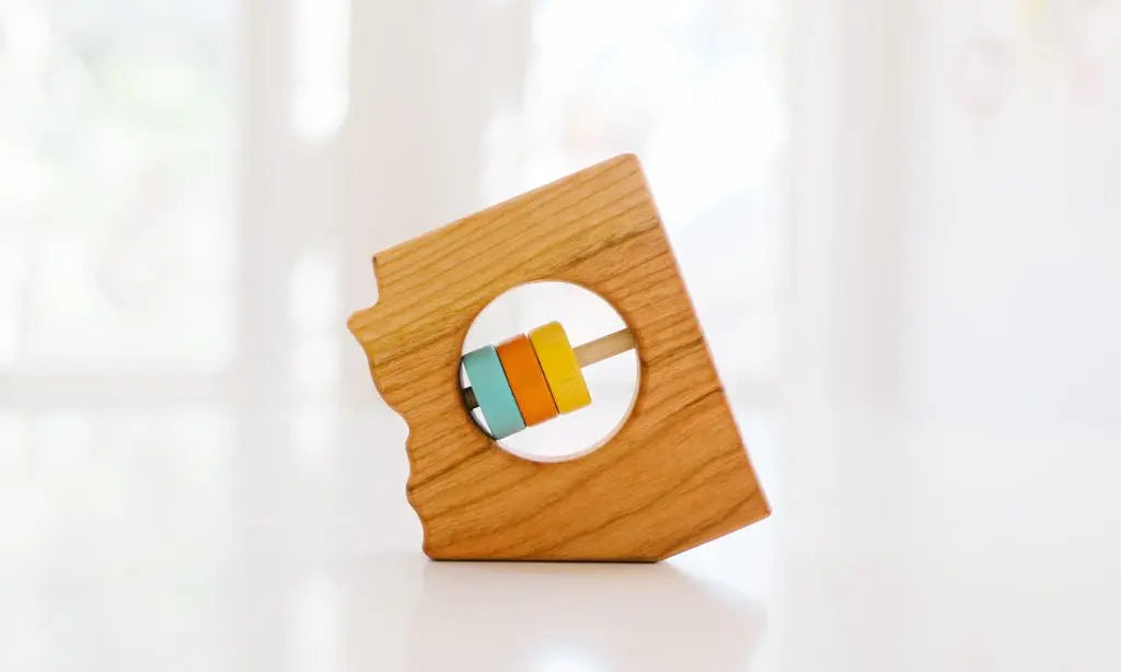 Bannor Toys Arizona State Wooden Baby Rattle, showing state-shaped cherry-wood body and colored rattle discs