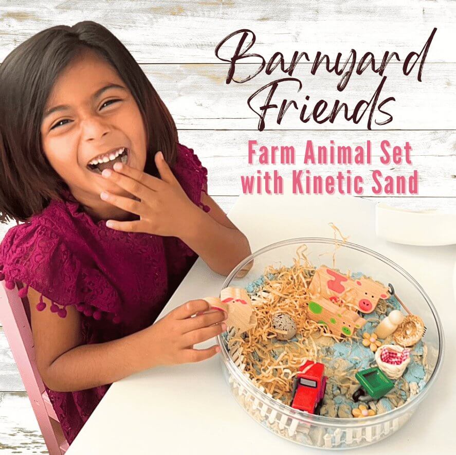 Child playing with the Barnyard Friends farm animal sand set