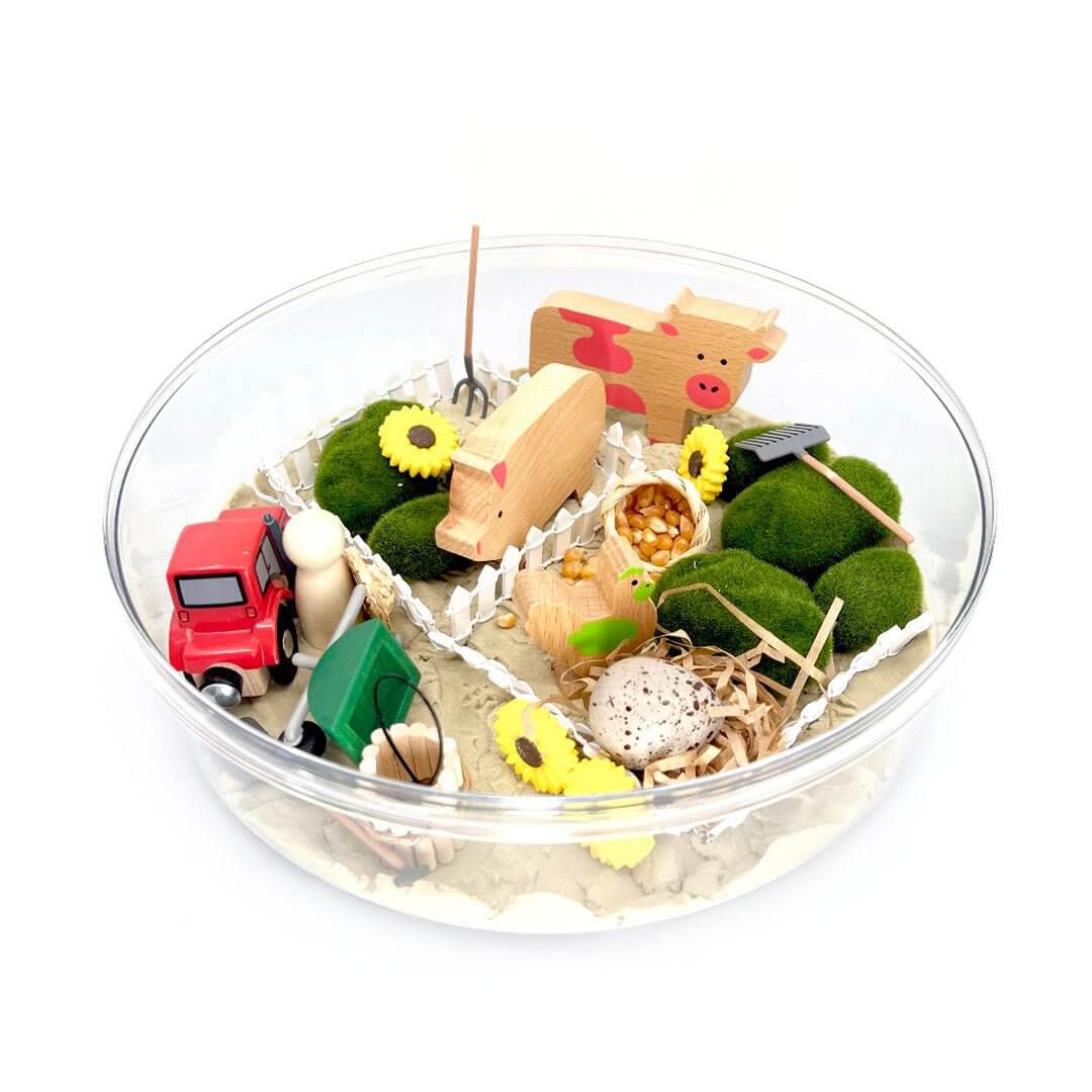 Barnyard Friends farm scene in a round tray; the pictured black-handled cylinder is not included