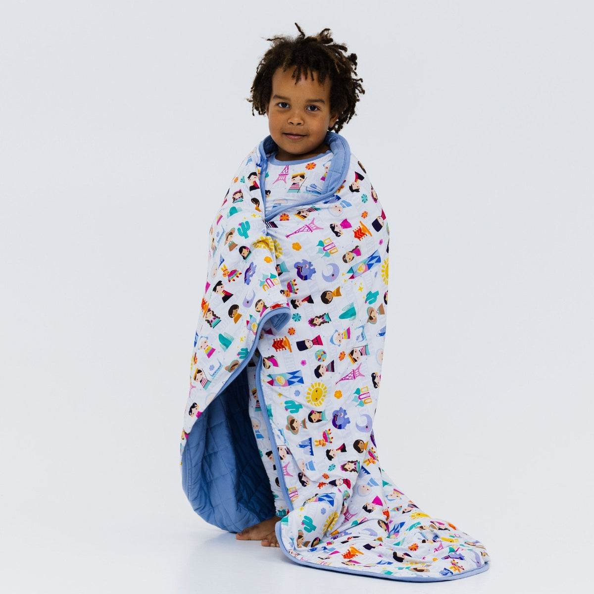 Child wrapped in Bam & Stitch Children of the World Blanket.
