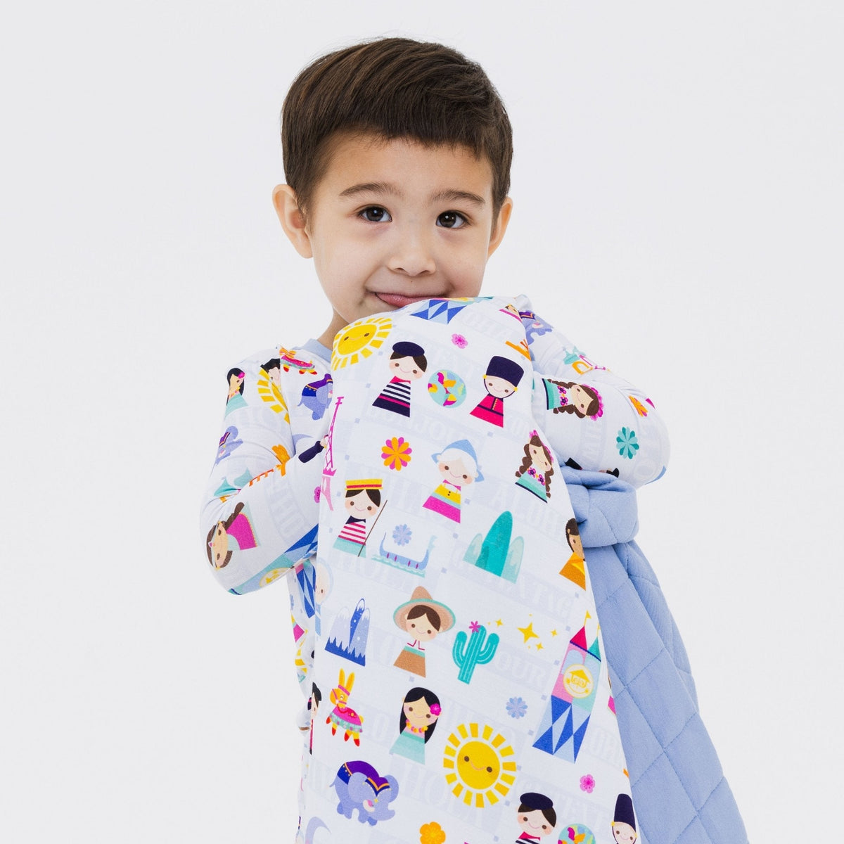 Child holding Bam & Stitch Children of the World Blanket.