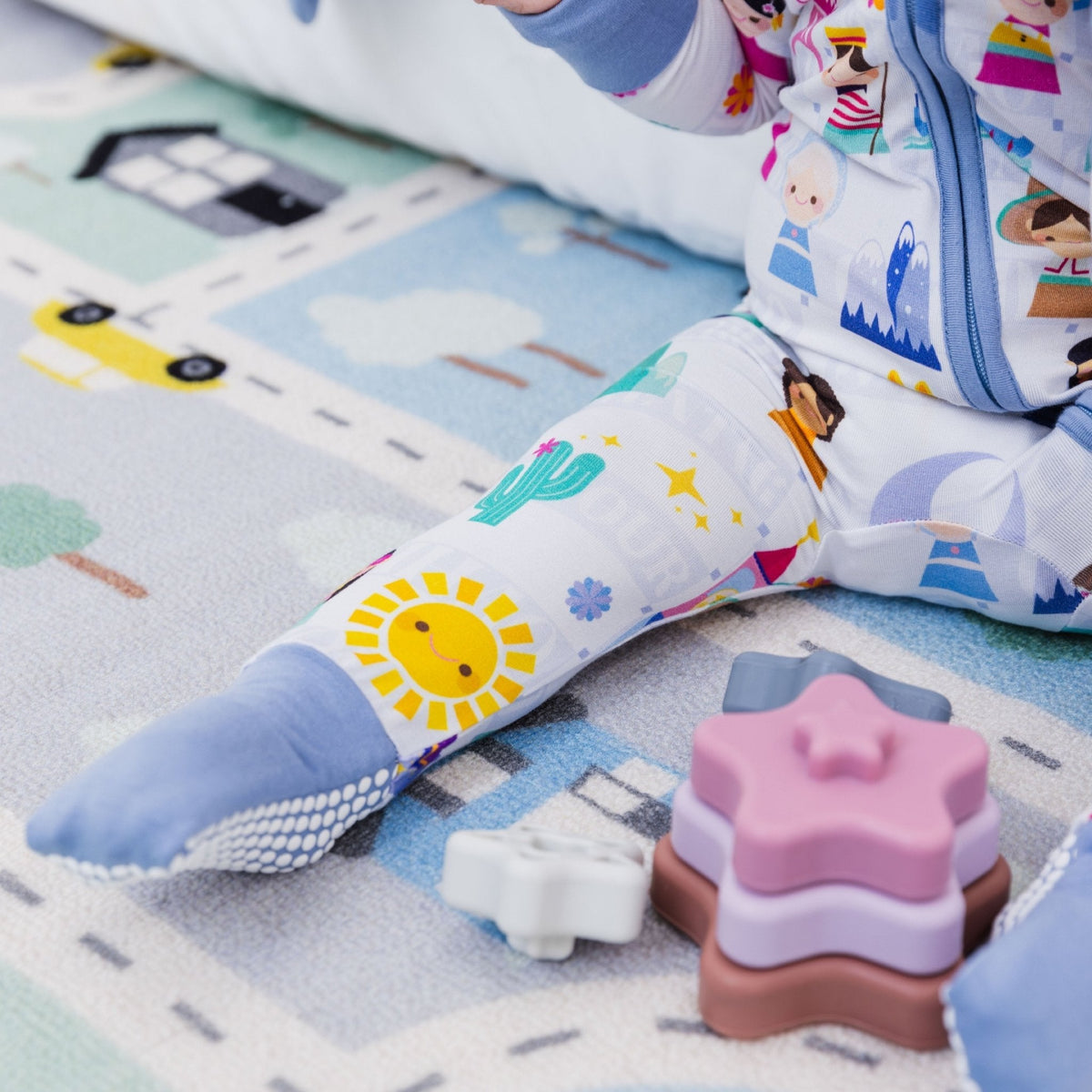 Close-up of the covered feet on Bam & Stitch Children of the World Convertible Romper.