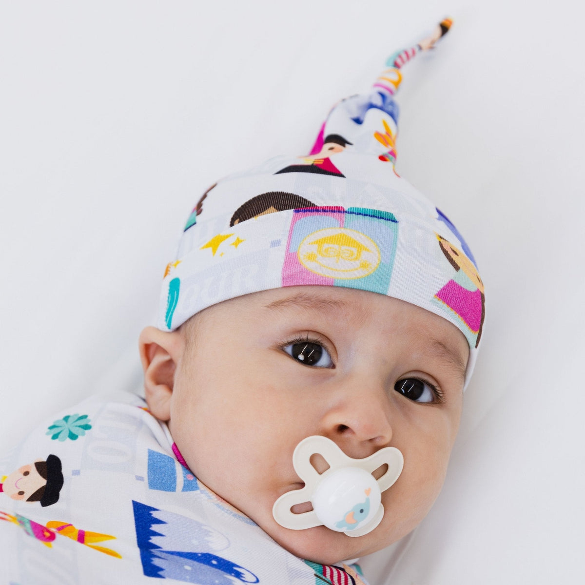 Baby wearing Bam & Stitch Children of the World Hat.