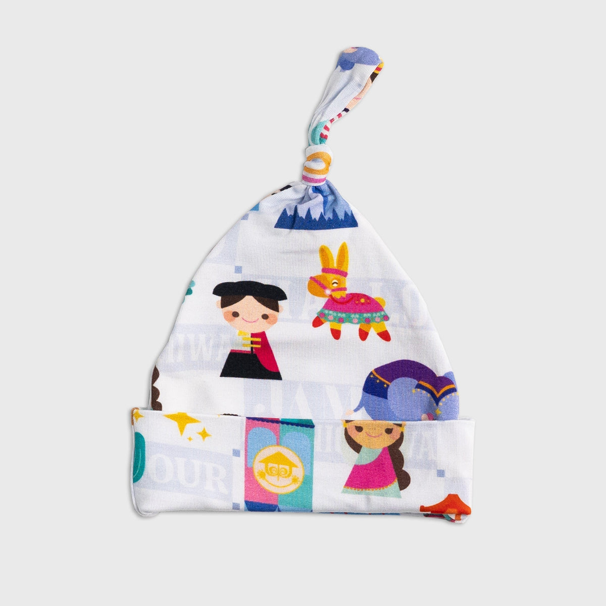Flat lay of Bam & Stitch Children of the World Hat, showing the top knot and folded brim.