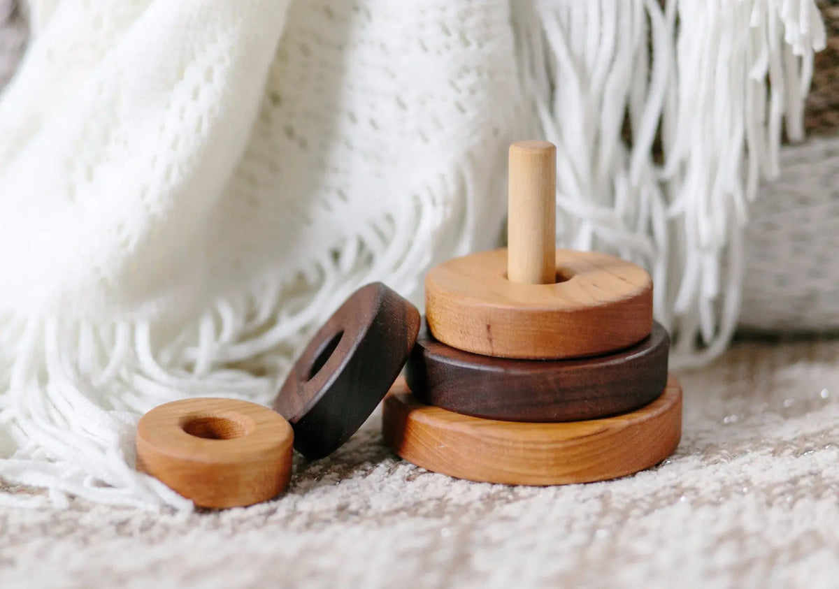 Bannor wooden Circle Stacker with loose rings beside the base
