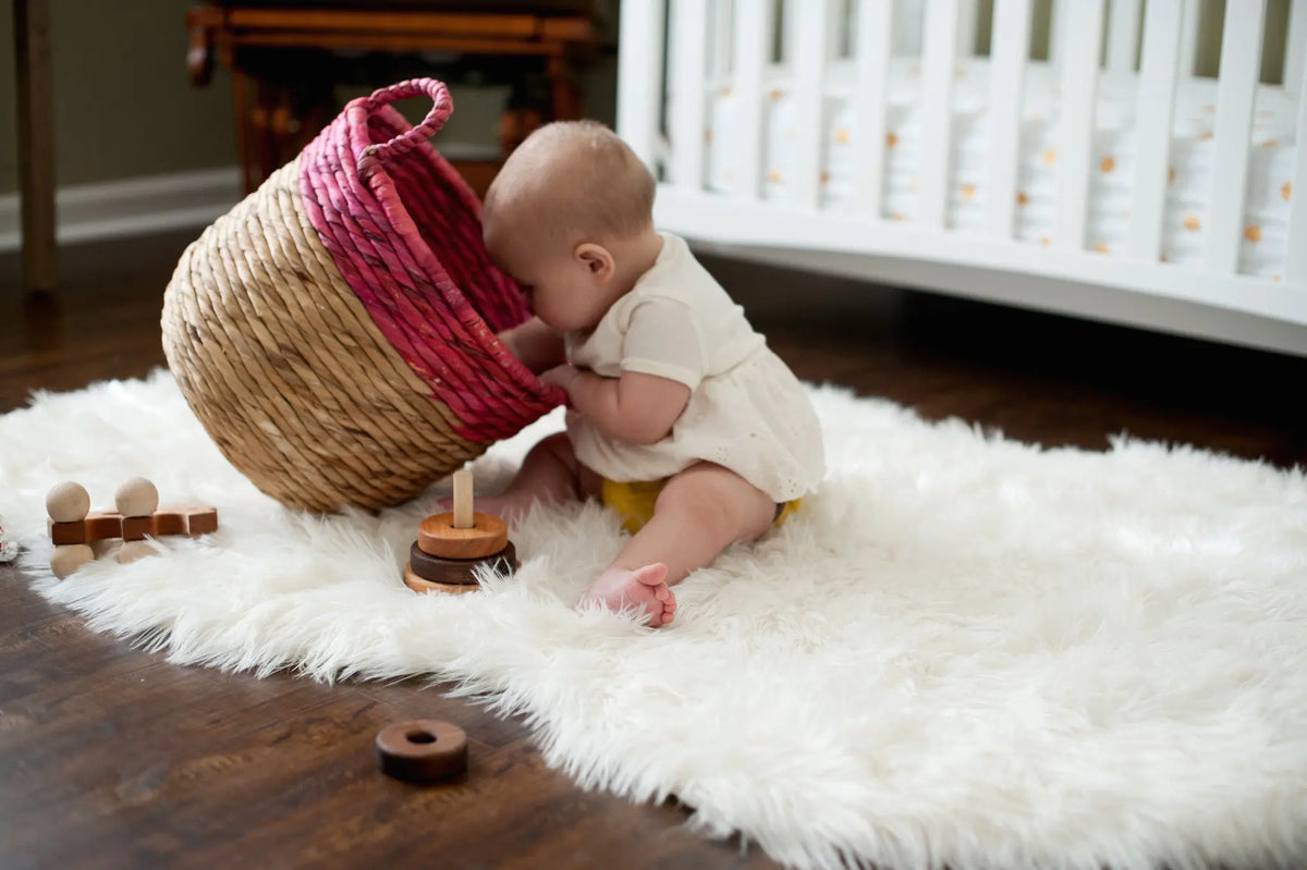 Lifestyle photo showing wooden stacking rings with a child