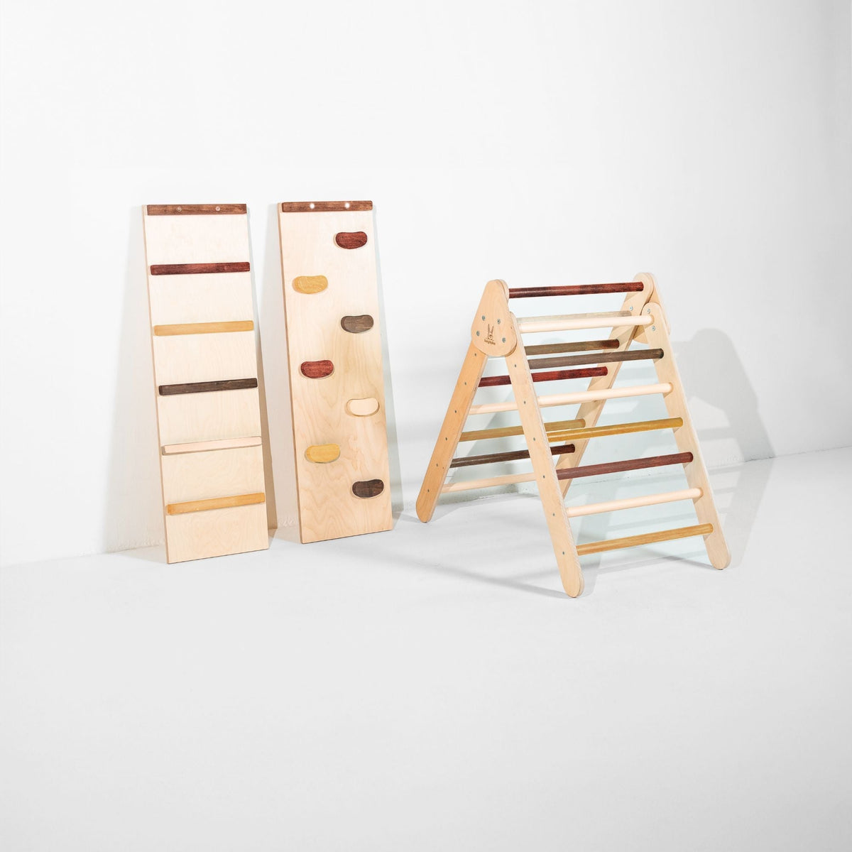Classic Climber triangle with mixed brown and cream rungs beside two upright ramps.
