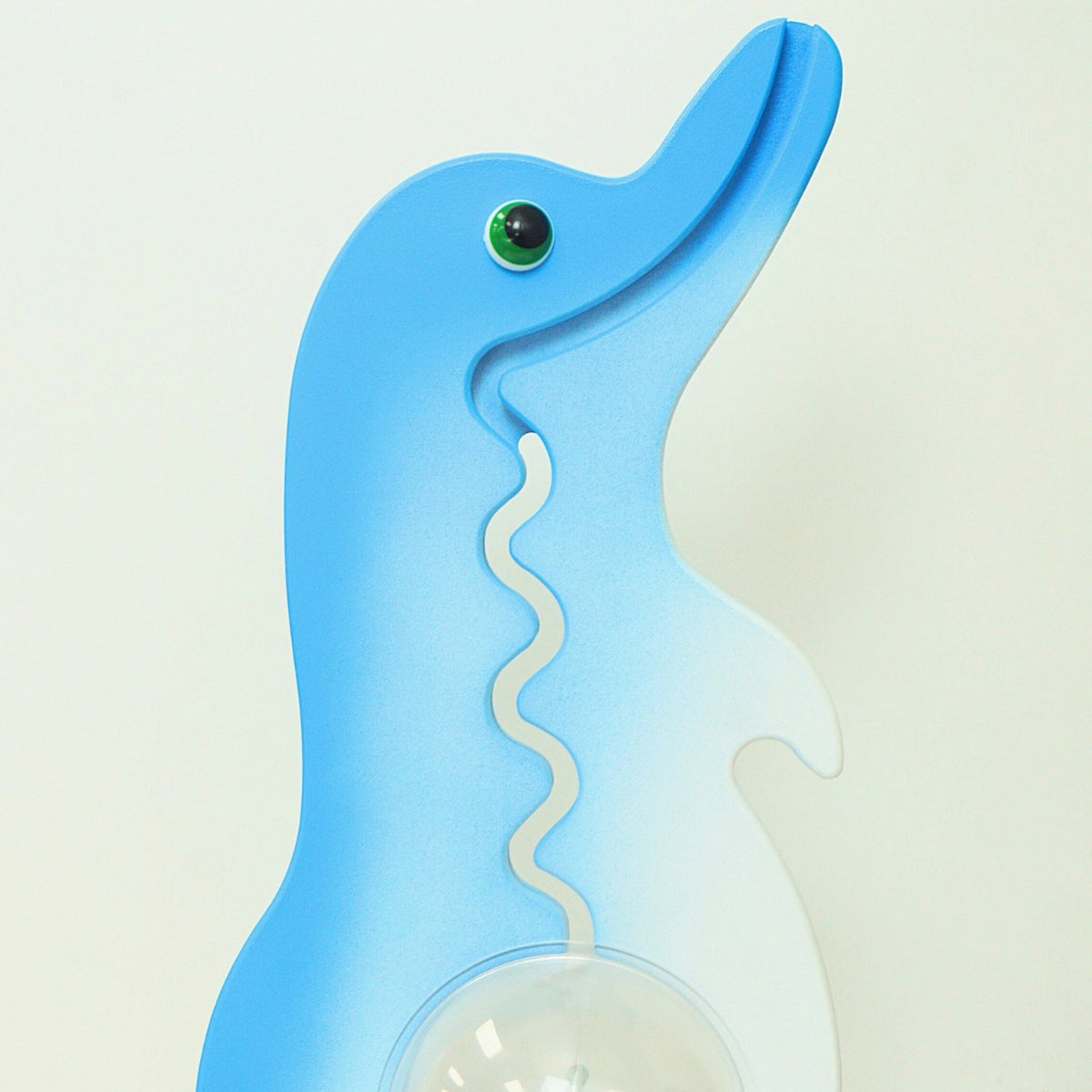 Close-up of the dolphin head and front coin track