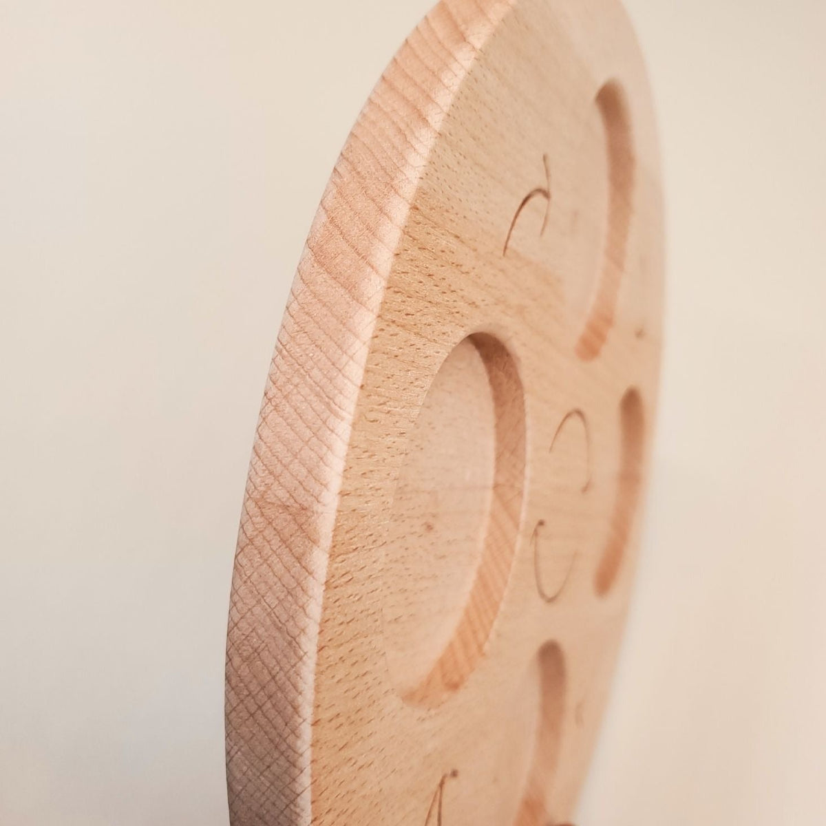 Side view showing the solid wooden edge of the life cycle board