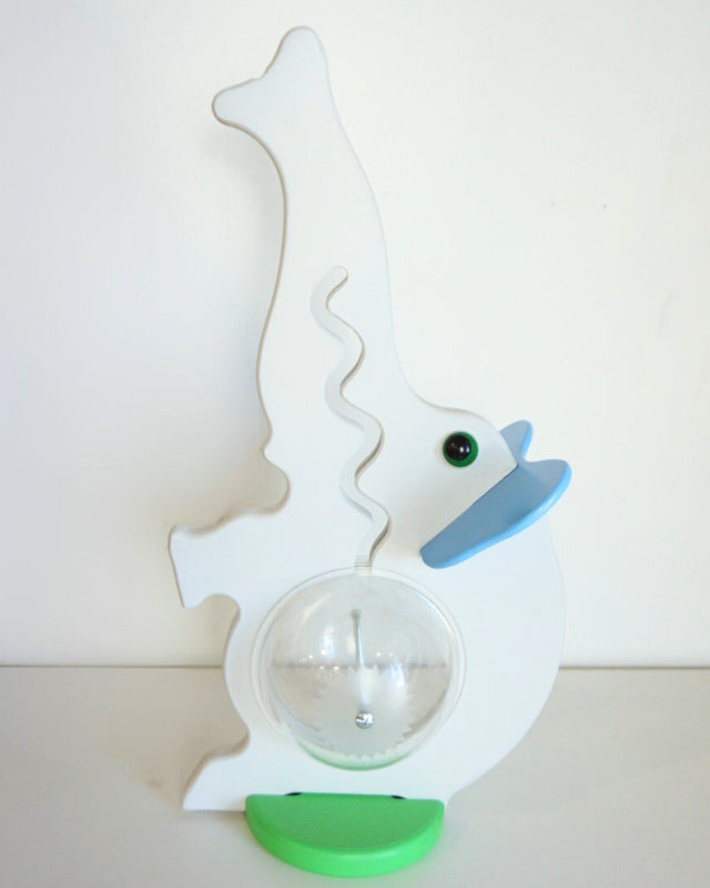 Reverse view of the gray elephant coin bank with blue ears