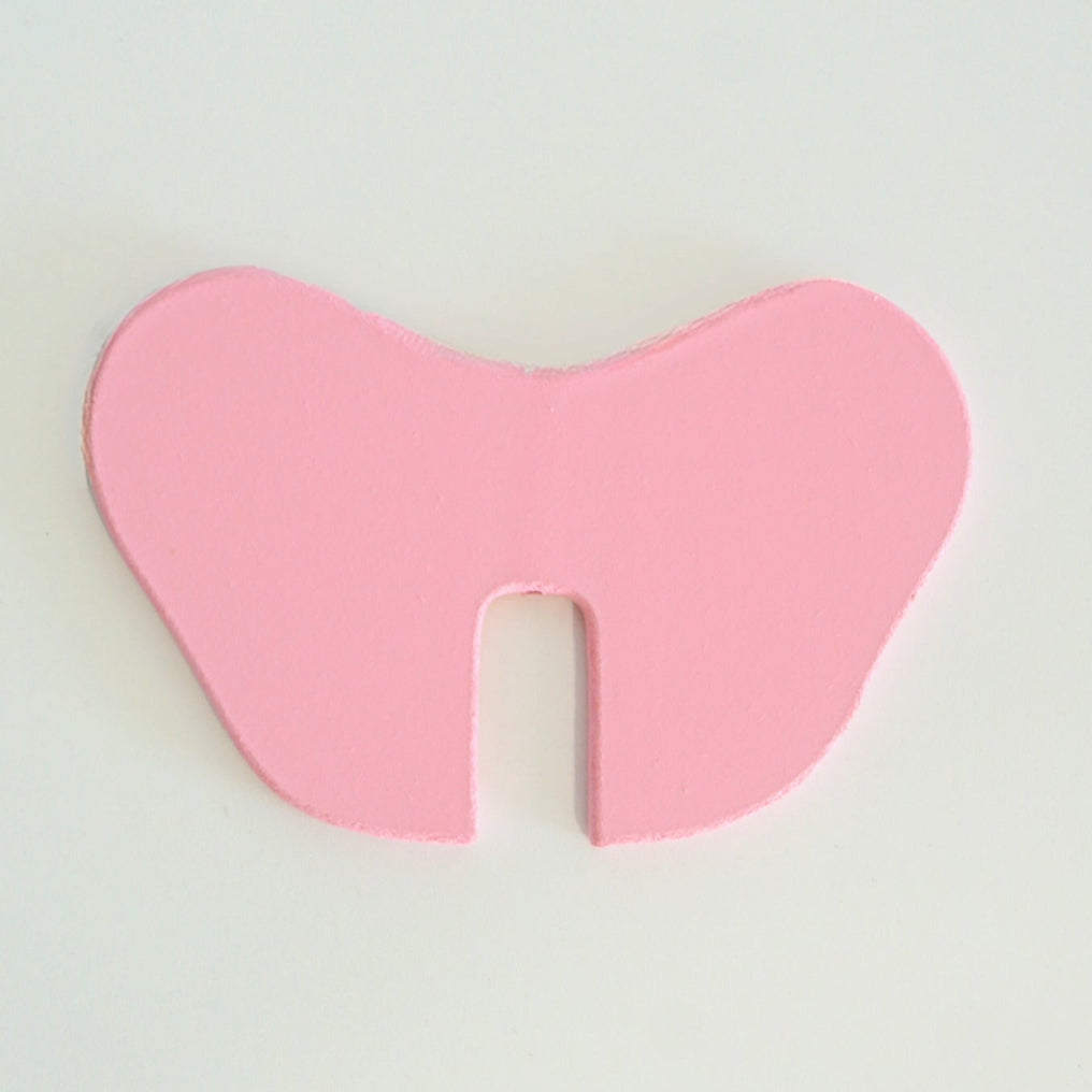 Pink ear piece with center cutout for the elephant coin bank