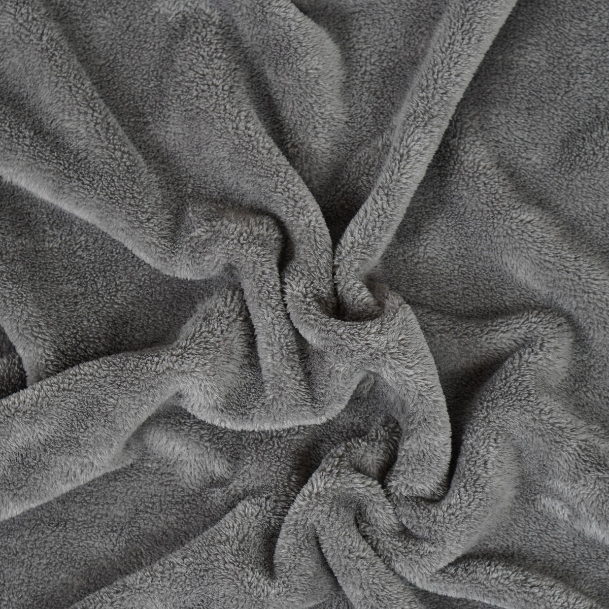 Gray fleece blanket gathered to show texture.