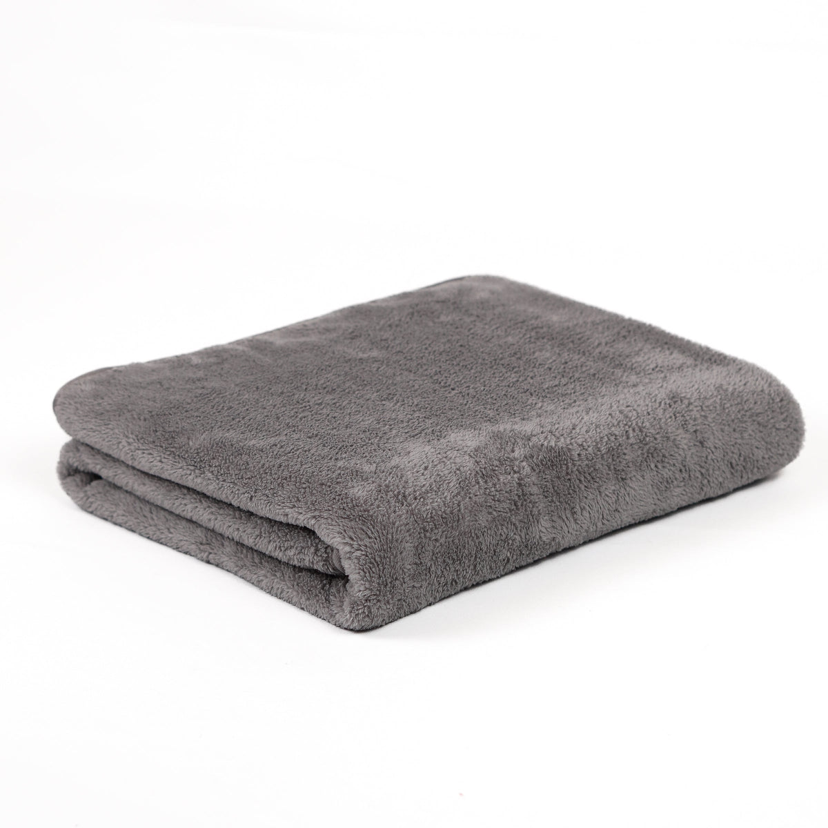 Gray fleece blanket folded on white.