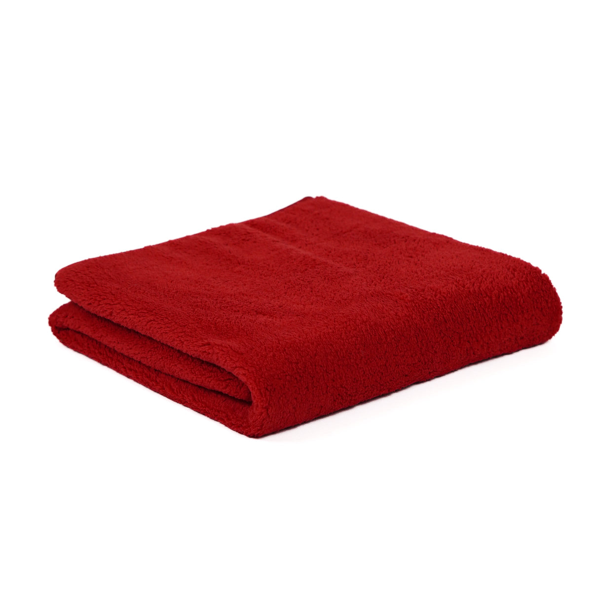 Red fleece blanket folded on white.