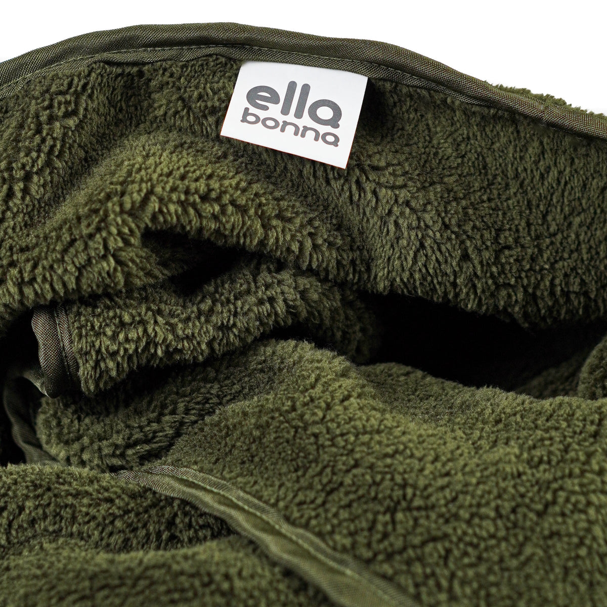 Olive green fleece blanket edge and Ella Bonna label close-up.
