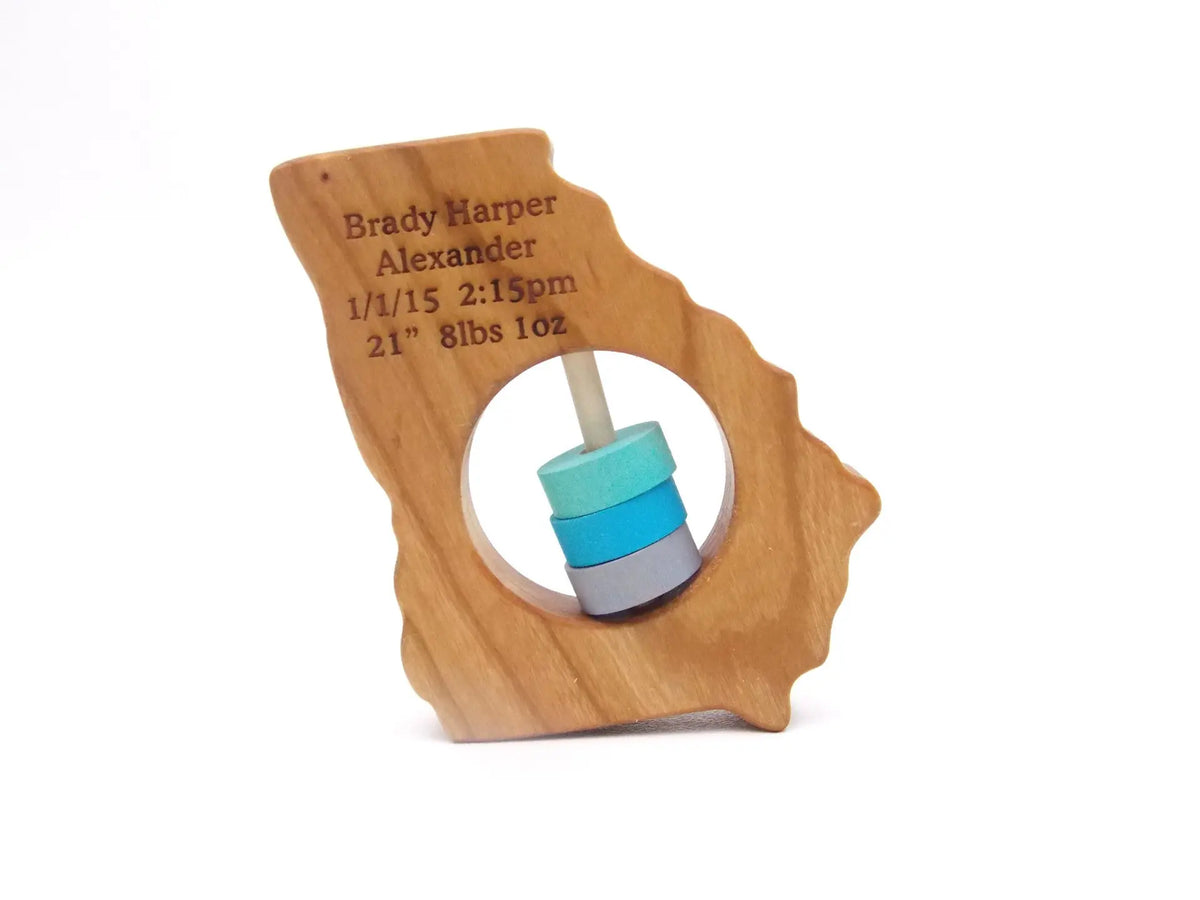 Bannor Toys Georgia State Wooden Baby Rattle with example laser engraving and colored rattle discs