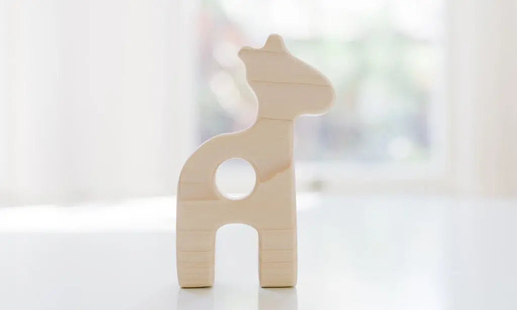 Bannor Toys Giraffe Wooden Baby Grasping Toy, showing smooth wooden outline with an open grasping space