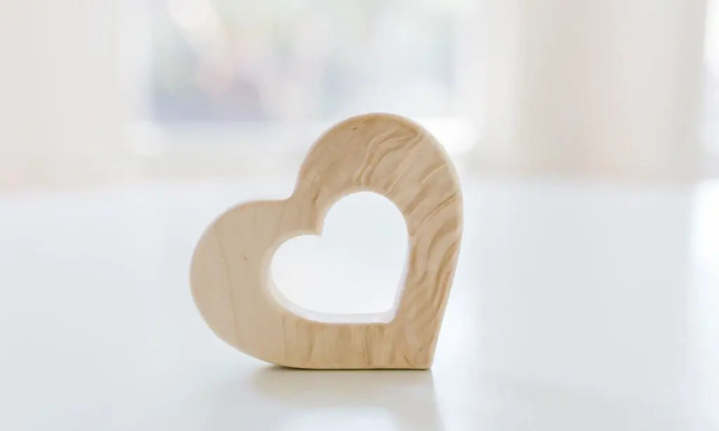 Bannor Toys Heart Wooden Baby Grasping Toy, showing smooth wooden outline with an open grasping space