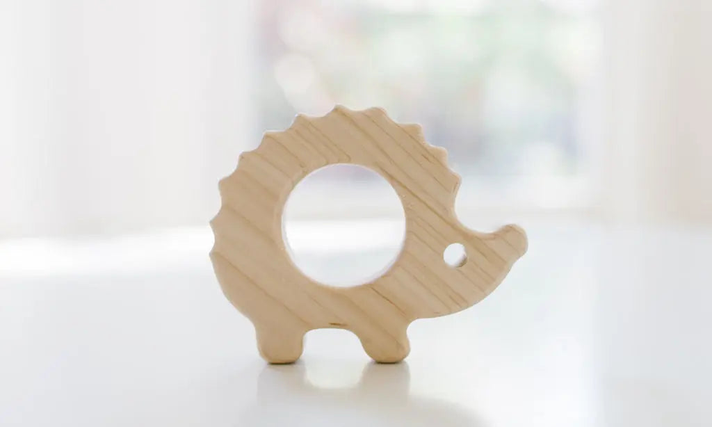 Bannor Toys Hedgehog Wooden Baby Grasping Toy, showing smooth wooden outline with an open grasping space