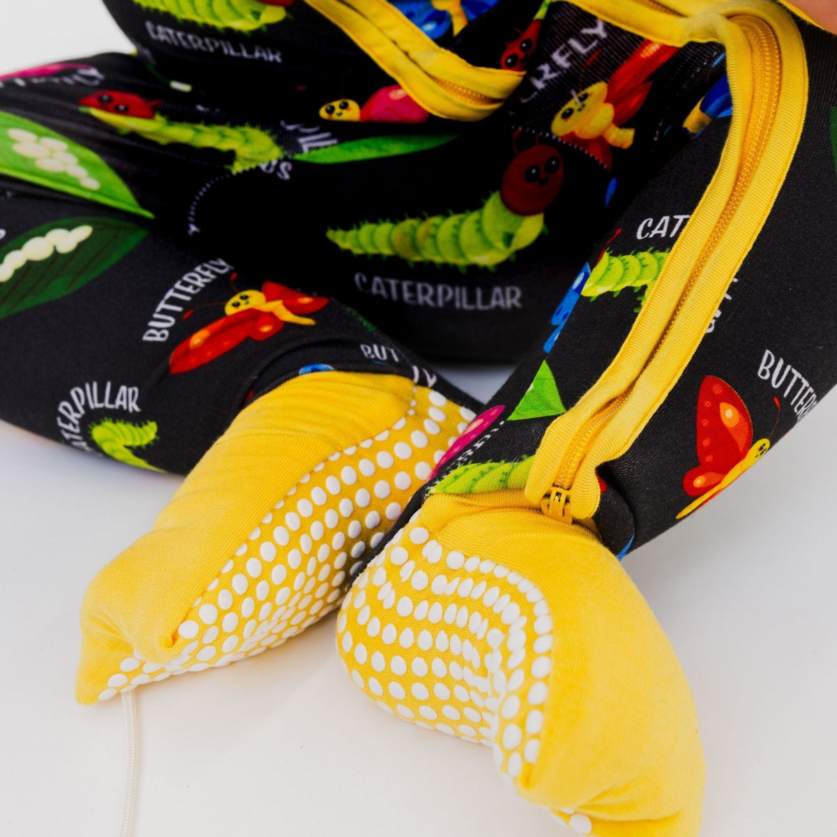Close-up of the fold-over feet and dotted soles on Bam & Stitch It's Morphing Time! Convertible Romper.