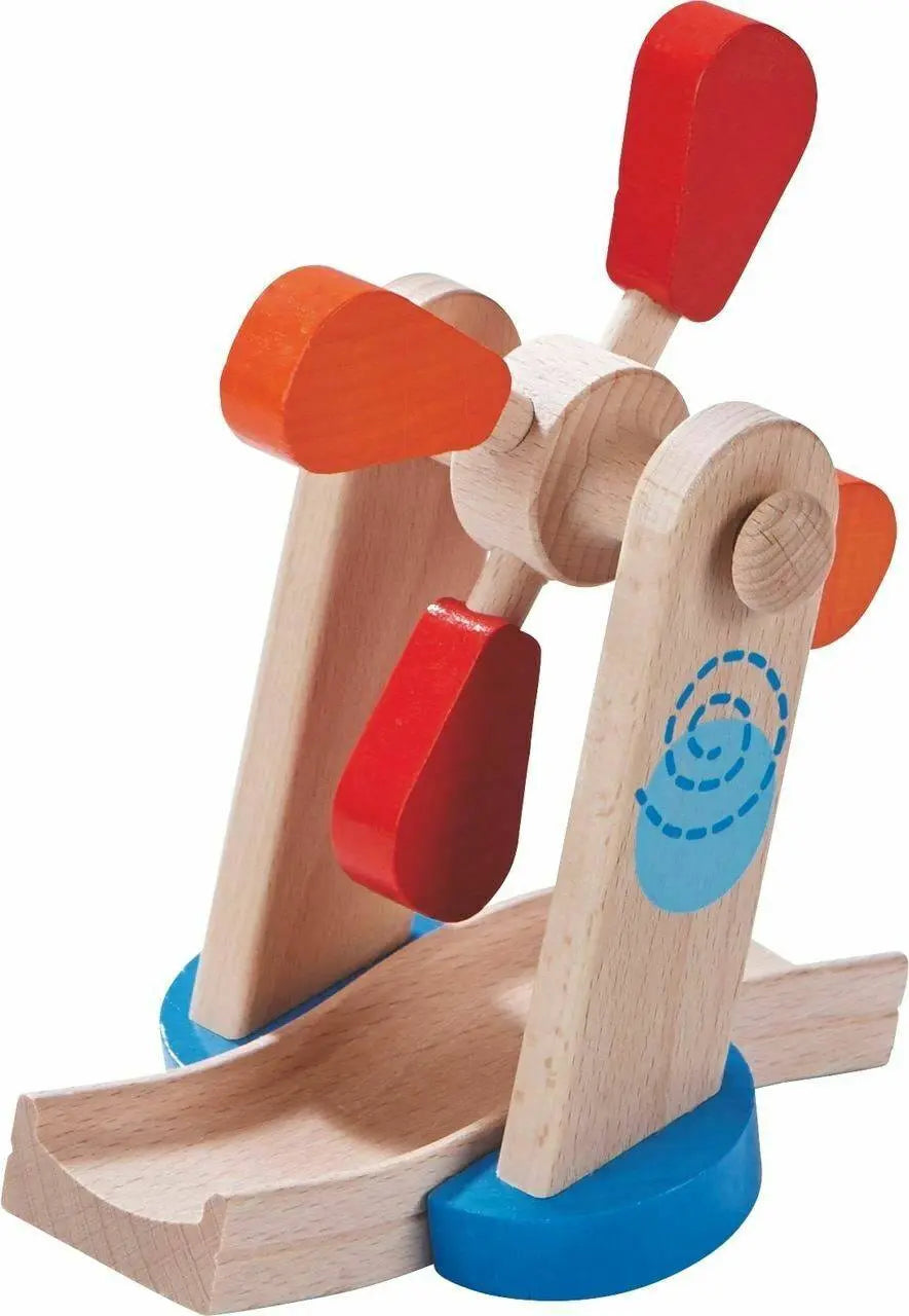 Close-up of the Kullerbu wooden windmill with red and orange paddles